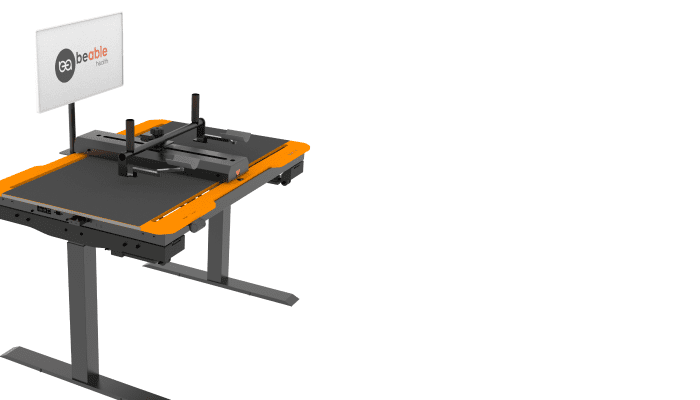 The ArmAble rehabilitation device — a motorized desk rig for upper-limb rehab therapy